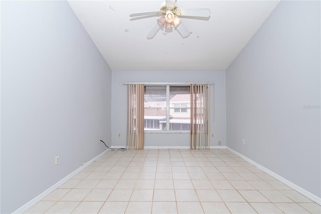 empty room featuring ceiling fan and light tile patterned flooring