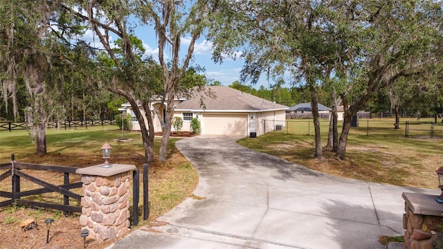 view of front of property with a front lawn and a garage