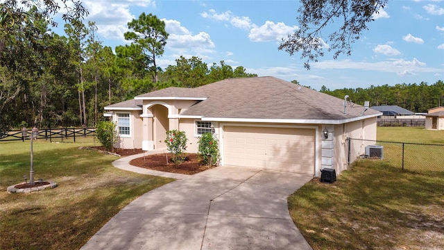 view of front of house featuring a front yard and a garage