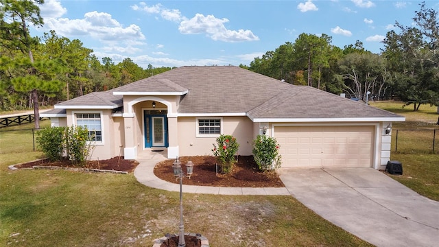 ranch-style home with a garage and a front lawn