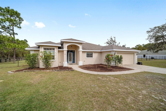 view of front of home featuring a front lawn and a garage