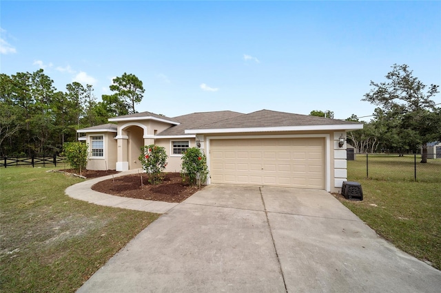 view of front of house featuring a front lawn and a garage