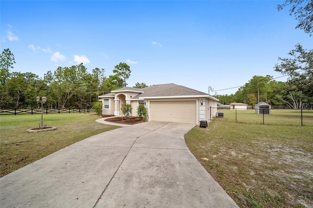 view of front of house with a front yard and a garage