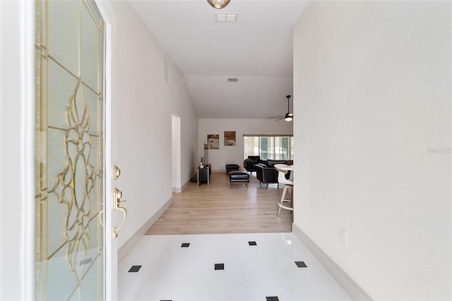 interior space with hardwood / wood-style floors and ceiling fan