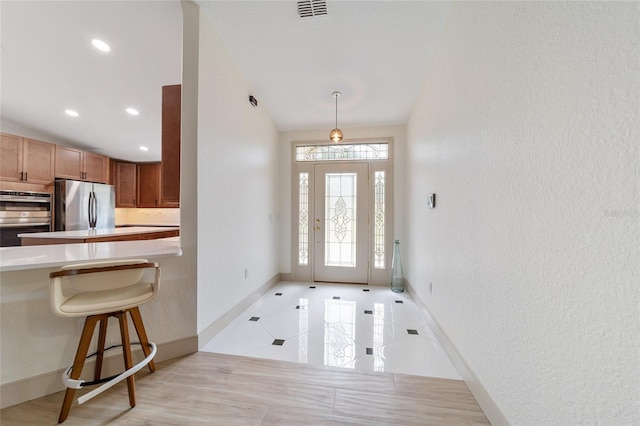 entrance foyer with lofted ceiling