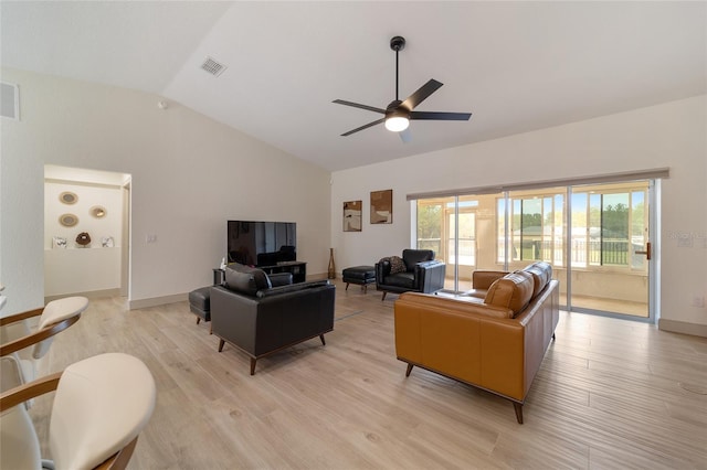 living room with light hardwood / wood-style floors, lofted ceiling, and ceiling fan