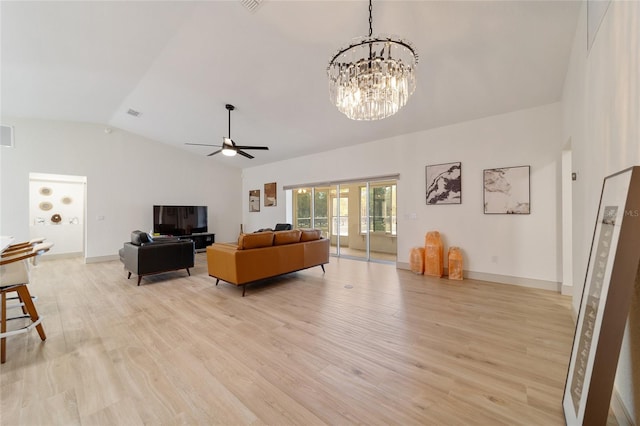 living room with french doors, light hardwood / wood-style floors, vaulted ceiling, and ceiling fan with notable chandelier