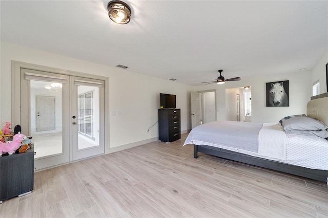 bedroom featuring light hardwood / wood-style flooring, french doors, access to outside, and ceiling fan