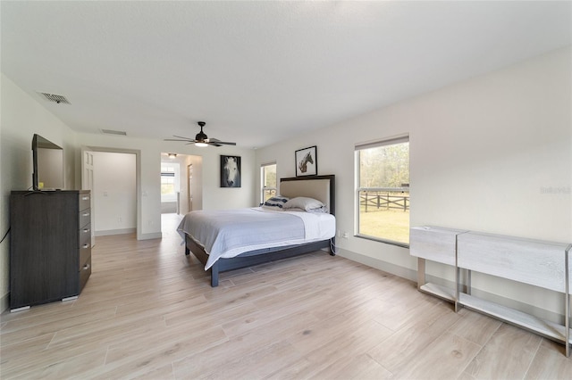 bedroom featuring light wood-type flooring and ceiling fan