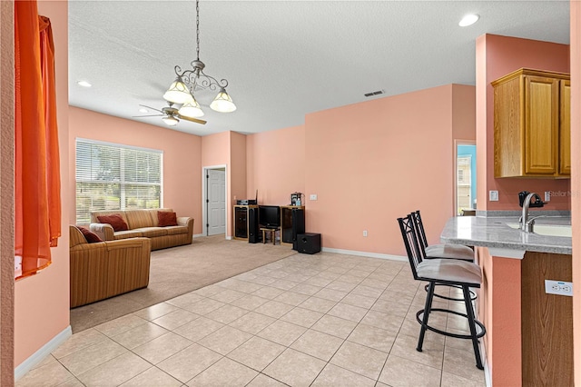 interior space featuring sink, a textured ceiling, and ceiling fan