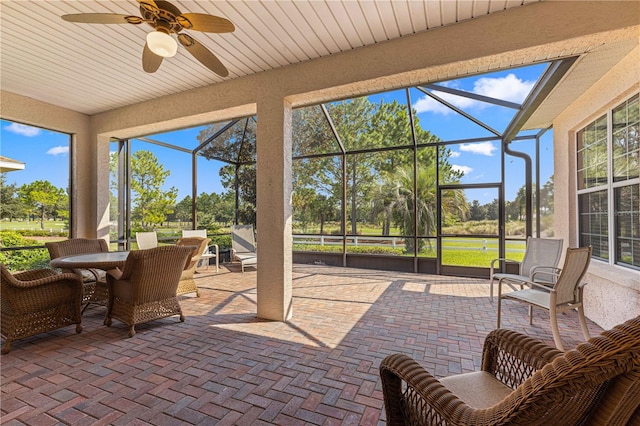 sunroom / solarium with ceiling fan