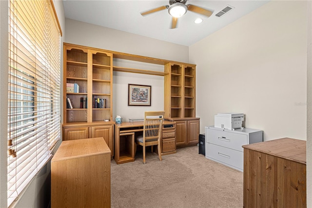 office featuring light carpet and ceiling fan