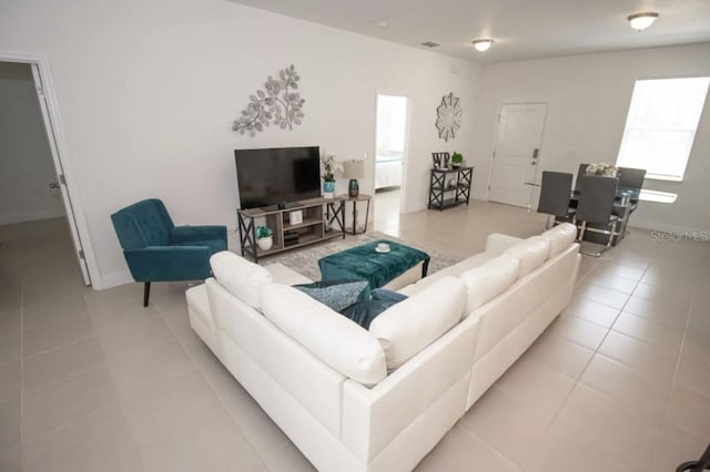 living room featuring light tile patterned flooring