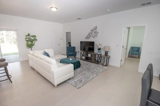 living room featuring light tile patterned floors