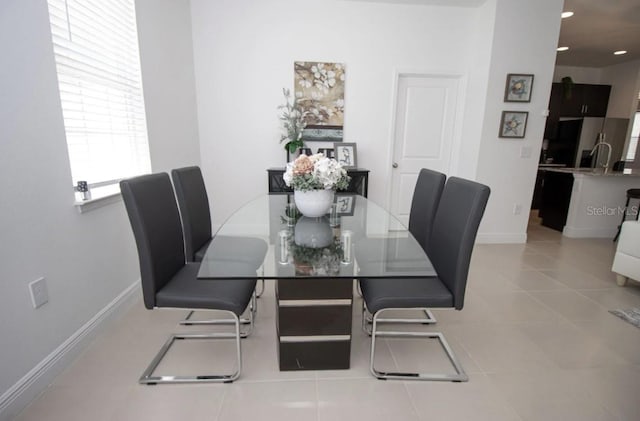 dining room featuring light tile patterned floors and a wealth of natural light