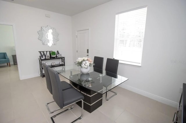 dining room featuring light tile patterned floors