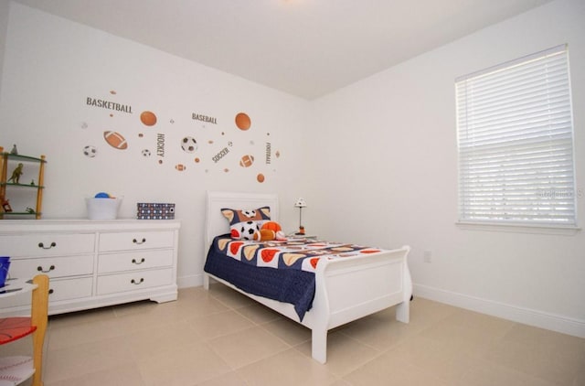 bedroom featuring light tile patterned floors