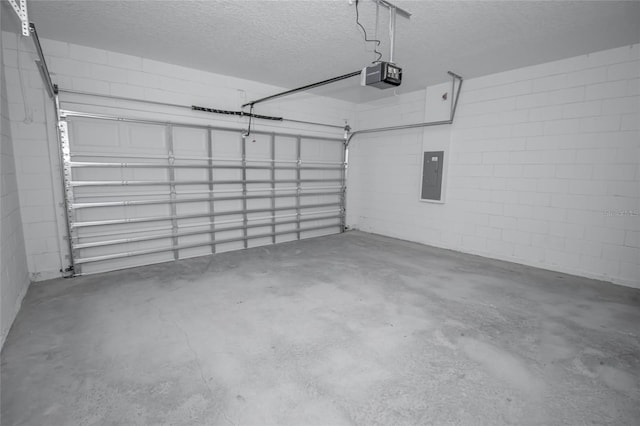 garage featuring electric panel and a garage door opener