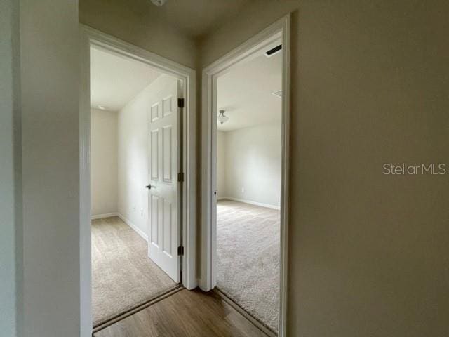 corridor featuring light hardwood / wood-style flooring