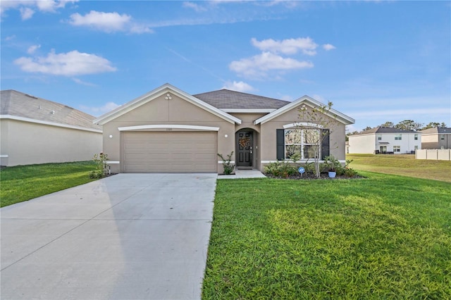 single story home featuring a garage and a front lawn