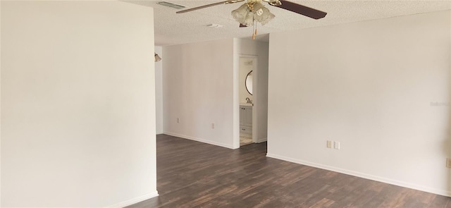 unfurnished room featuring a textured ceiling, ceiling fan, and dark wood-type flooring