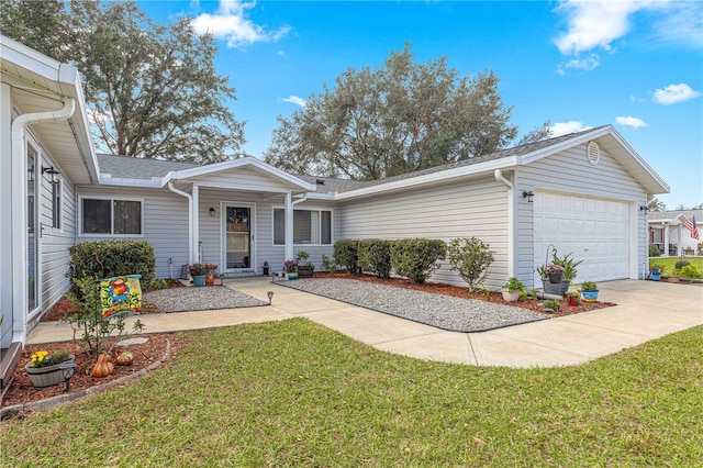 ranch-style house featuring a front lawn and a garage