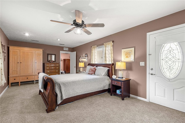 bedroom featuring multiple windows, carpet floors, and ceiling fan