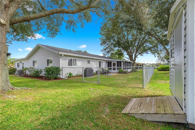 back of property featuring a lawn