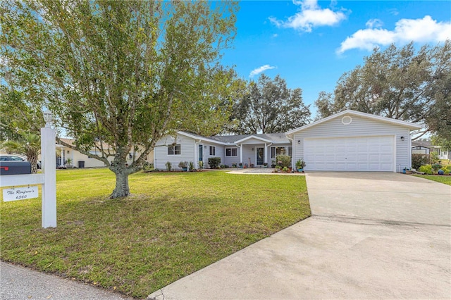 ranch-style home featuring a front yard and a garage