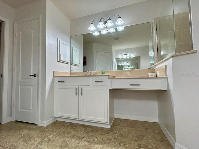 bathroom with tile patterned flooring and vanity