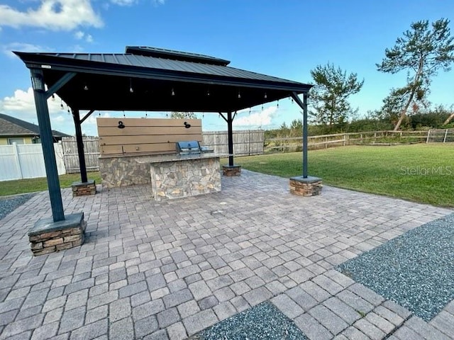 view of patio / terrace featuring a gazebo and area for grilling