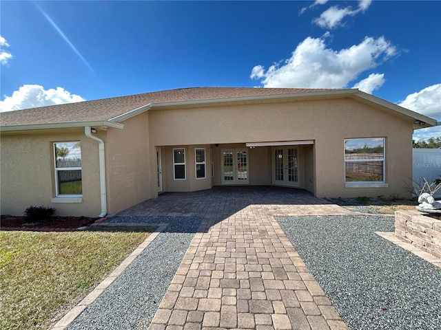 rear view of property with french doors