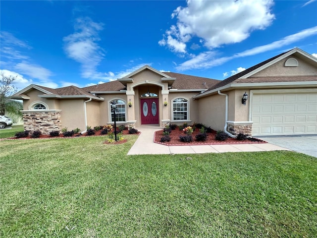 view of front facade with a front yard and a garage