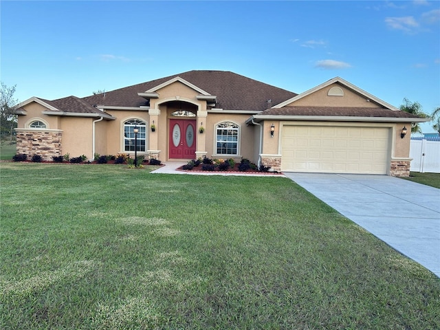 ranch-style home featuring a garage and a front yard