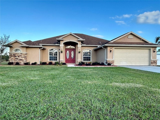 single story home with a front yard and a garage