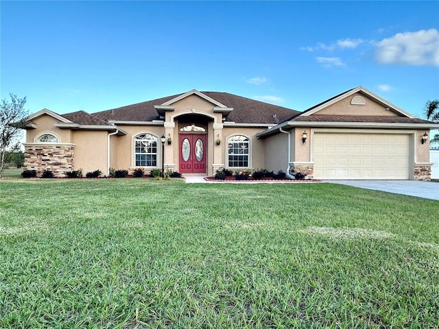 ranch-style house featuring a garage and a front lawn