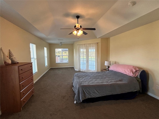 carpeted bedroom featuring ceiling fan and vaulted ceiling