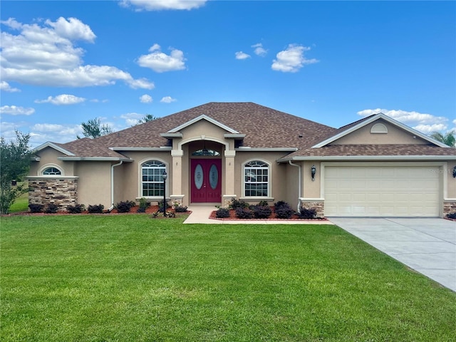 10923 SW 38th Ave, Ocala, FL 34476 - view of front facade with an attached garage, stucco siding, concrete driveway, a front yard, and roof with shingles