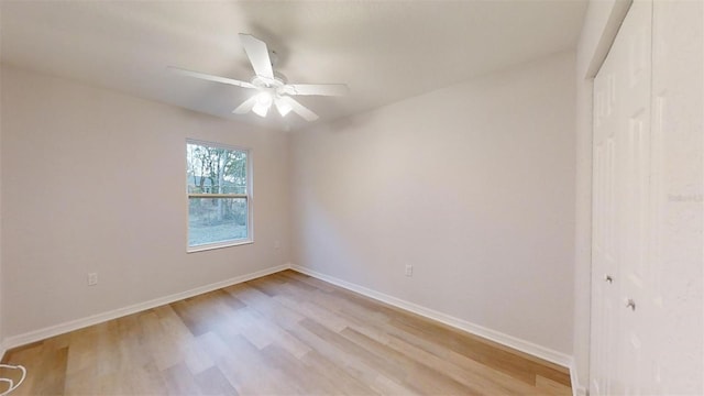 unfurnished room featuring ceiling fan and light wood-type flooring