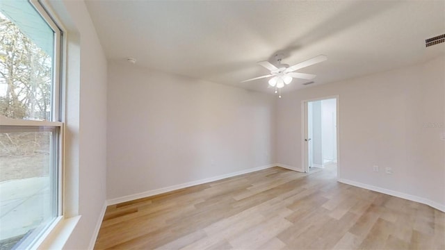 spare room with ceiling fan and light hardwood / wood-style flooring