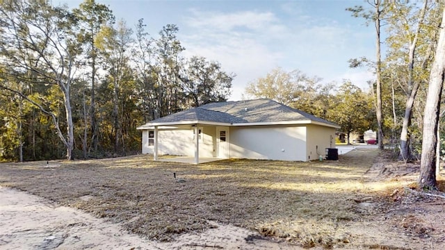 view of property exterior with central AC