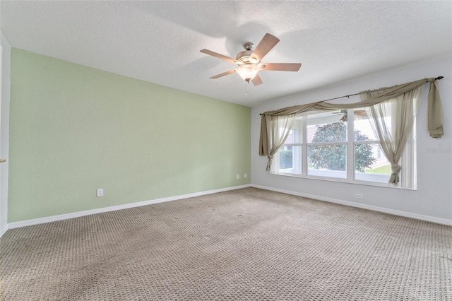 unfurnished room featuring ceiling fan, a textured ceiling, and carpet floors