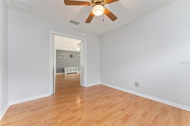 unfurnished room featuring light hardwood / wood-style floors and ceiling fan