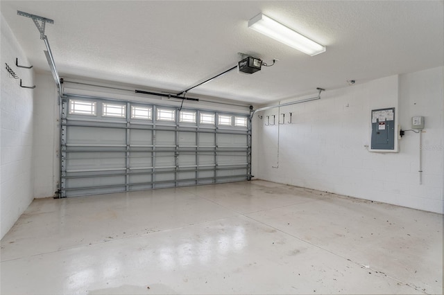 garage featuring a garage door opener and electric panel