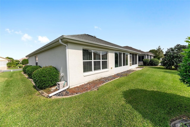 view of property exterior featuring a lawn