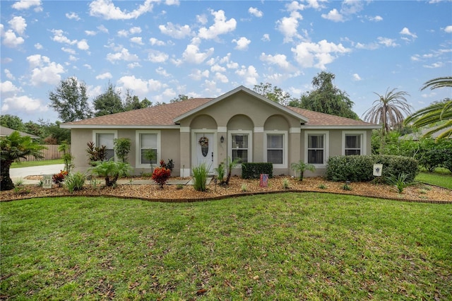 ranch-style house featuring a front lawn