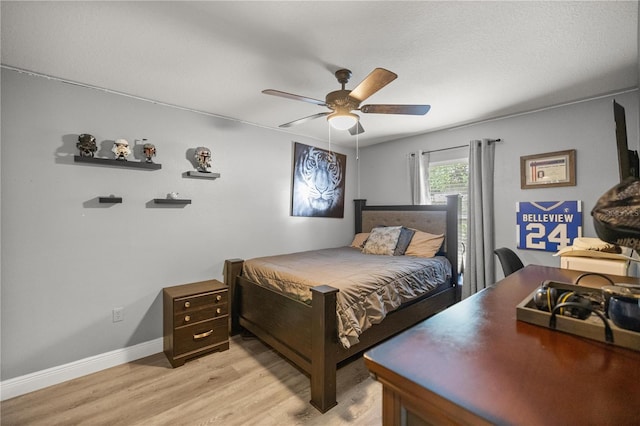 bedroom with light wood-type flooring and ceiling fan