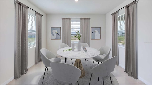 dining area with light tile patterned floors