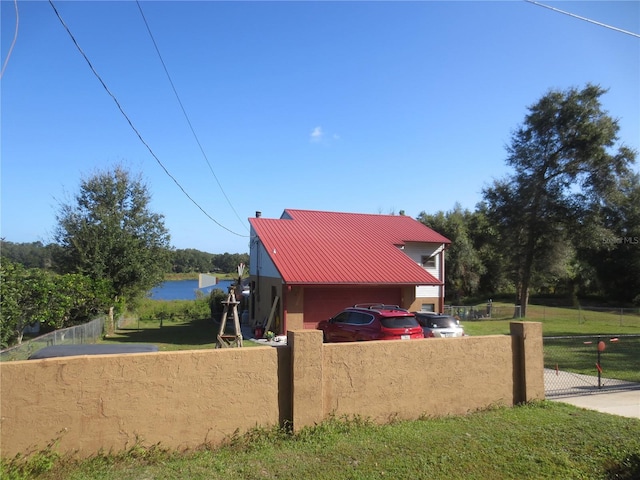 view of side of property with a yard