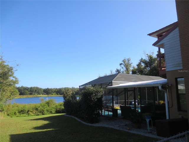 view of yard featuring a water view and a balcony